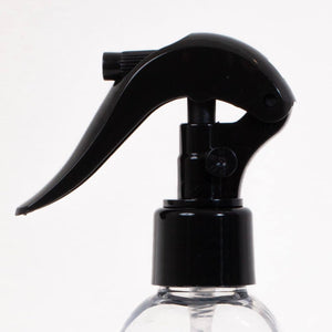 
                  
                    This is a picture of a black spray nozzle that is attached to a plastic bottle.
                  
                